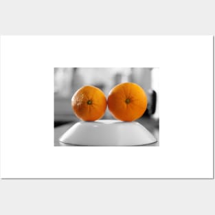 Oranges with a black and white background set on the plate Posters and Art